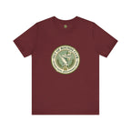 Maroon t-shirt with a green and white logo on a white background